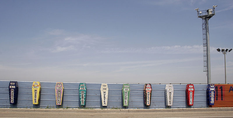 Monument for those who have died attempting to cross the US-Mexican border. Each coffin represents a year and the number of dead. It is a protest against the effects of Operation Guardian. Taken at the Tijuana-San Diego border (2006). © Tomas Castelazo.