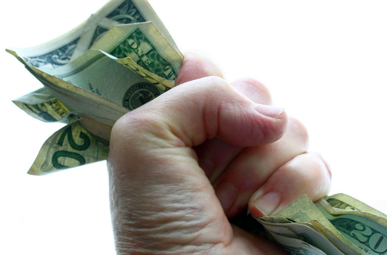 Money clutched in hand