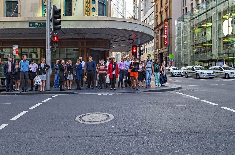 Pedestrians waiting for lights to change