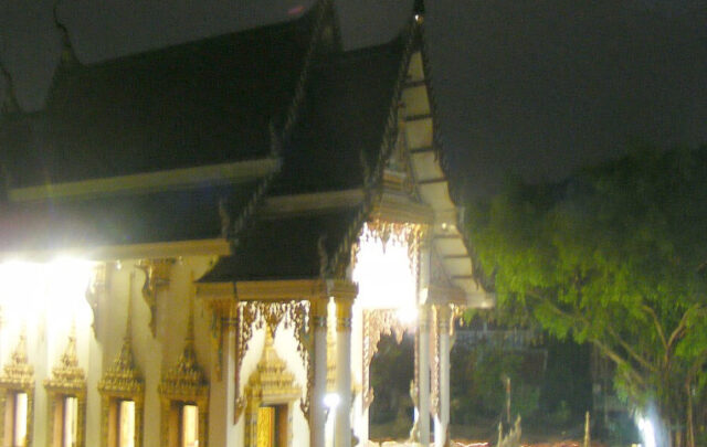 Walk with lighted candle around a Buddhist stupa
